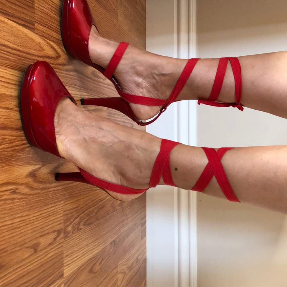 Stuart Weitzman red tied up high heels.